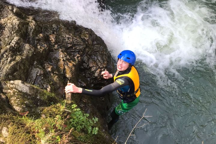 a man riding a wave on a surfboard in the water