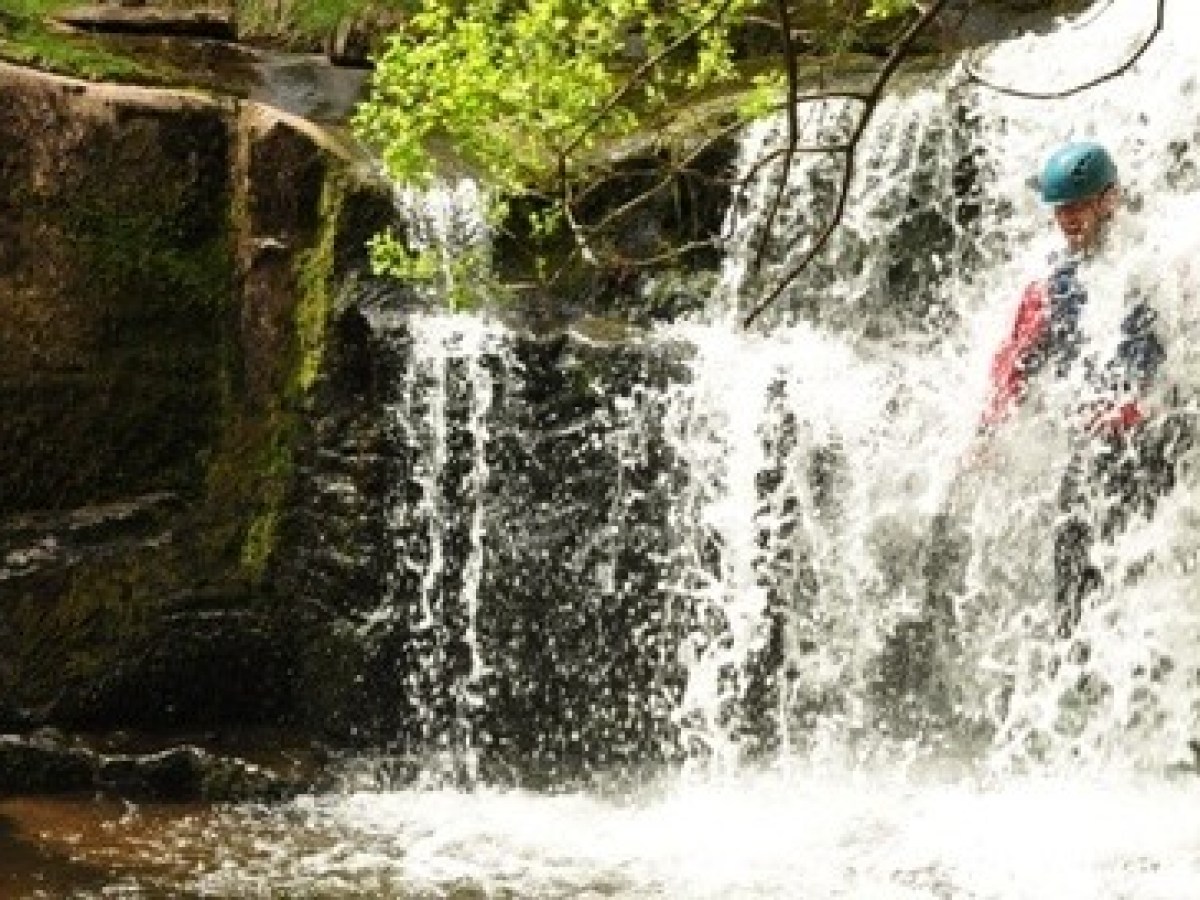 a large waterfall over some water