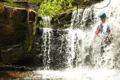 a large waterfall over some water