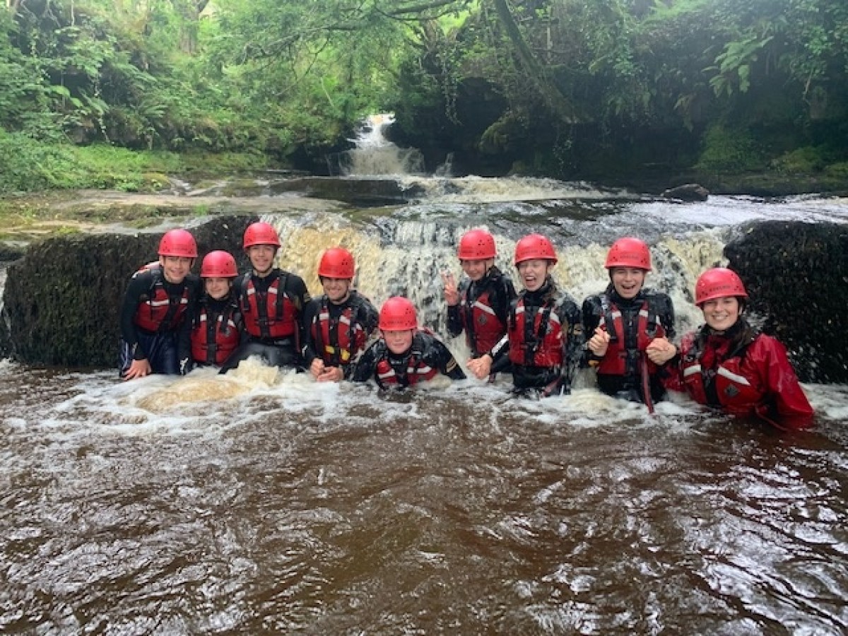 a group of people on a raft in a river