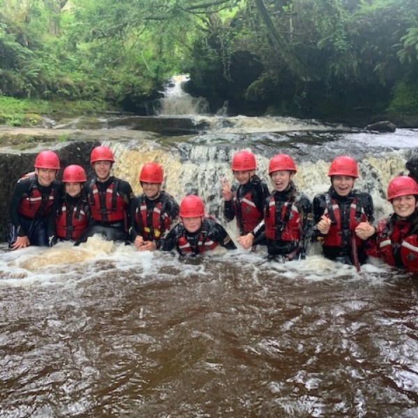Half Day Gorge Adventure Image 2 a group of people on a raft in a river