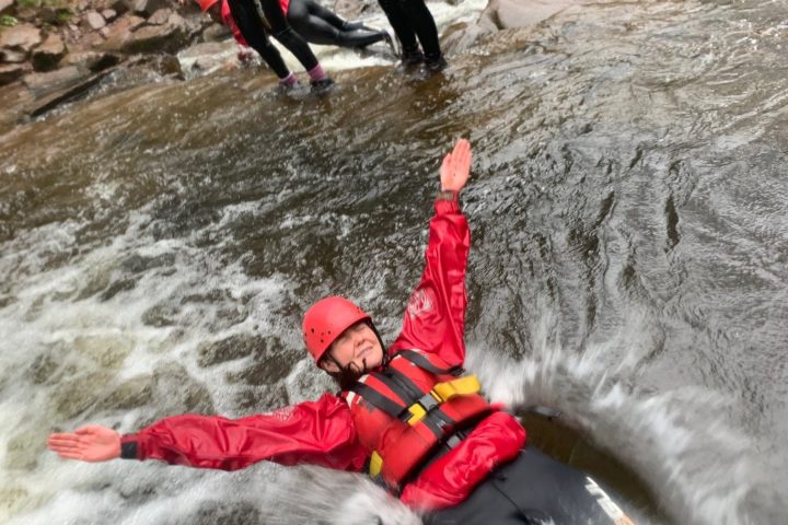 a person riding skis down a river