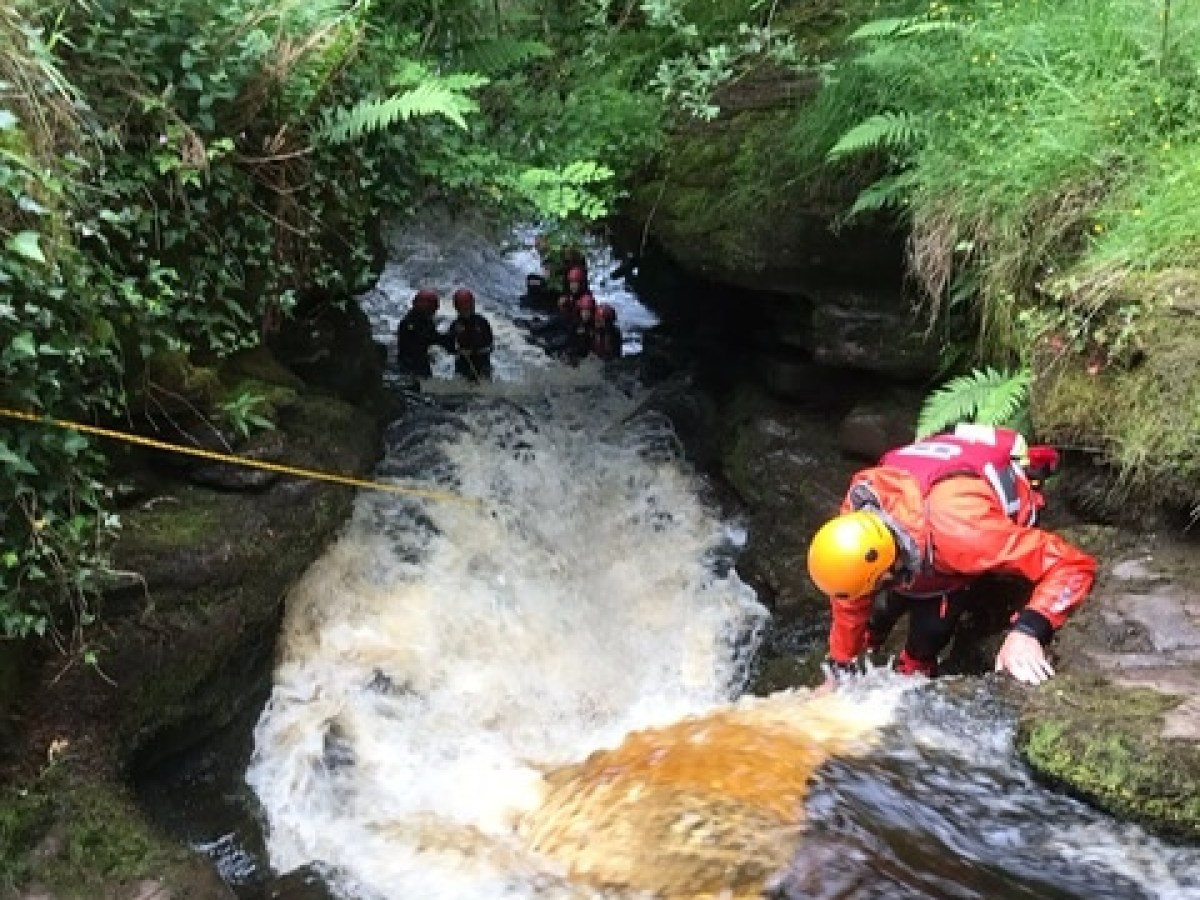 a raft next to a waterfall