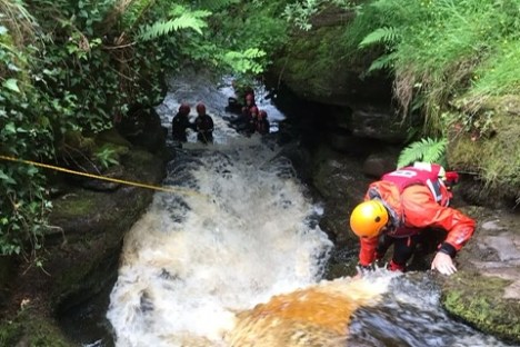 a raft next to a waterfall