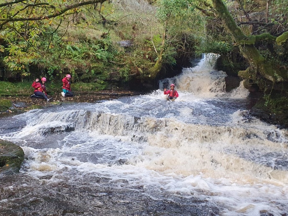a fire hydrant on the side of a river