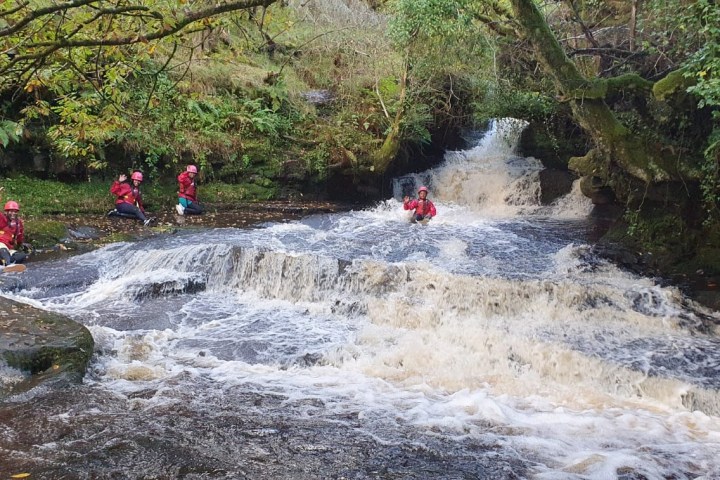a fire hydrant on the side of a river
