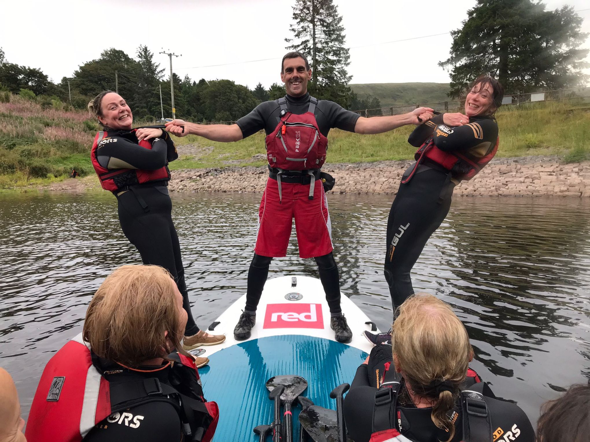 a group of people on a boat in the water