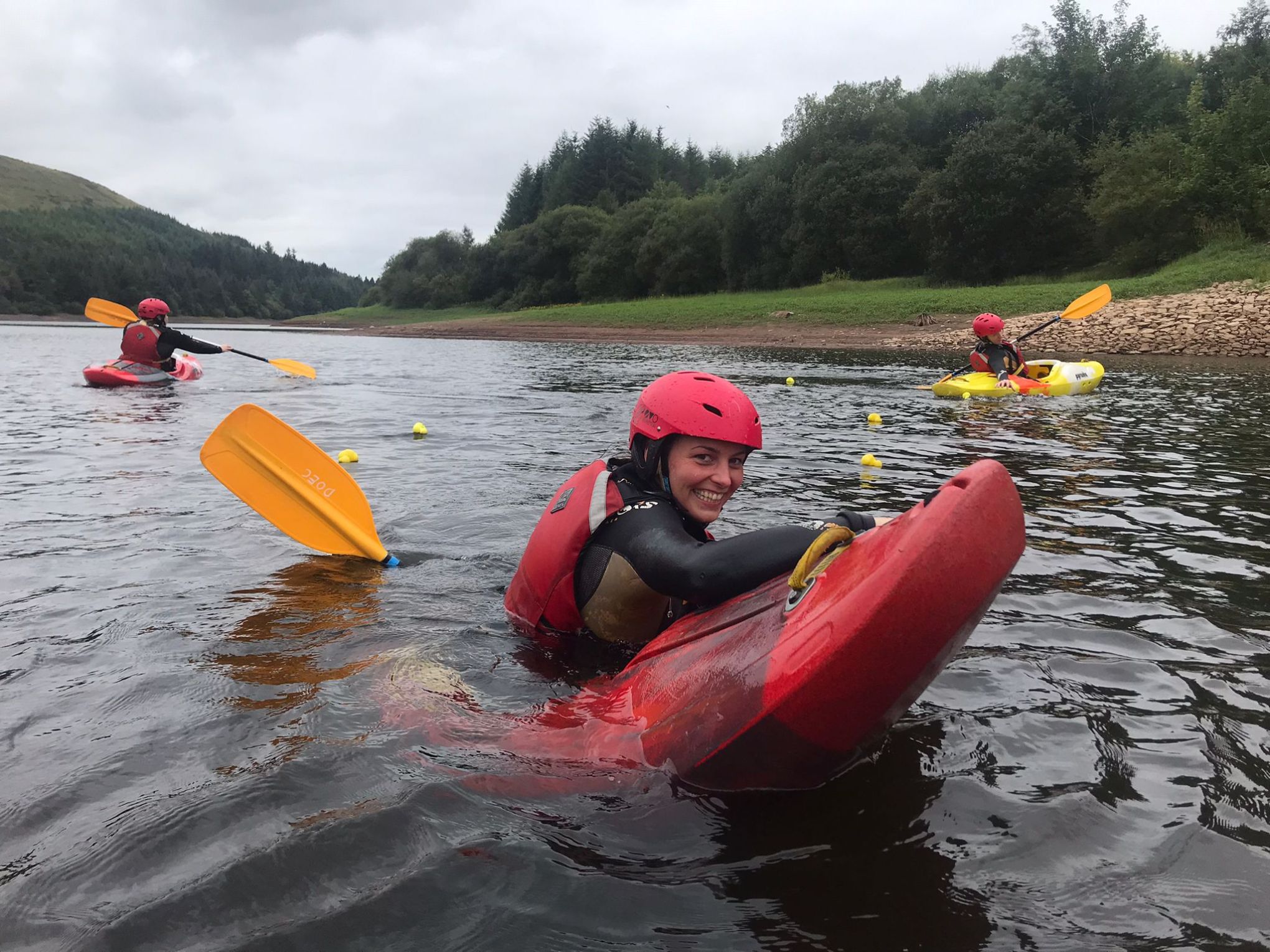 a group of people on a raft in a body of water
