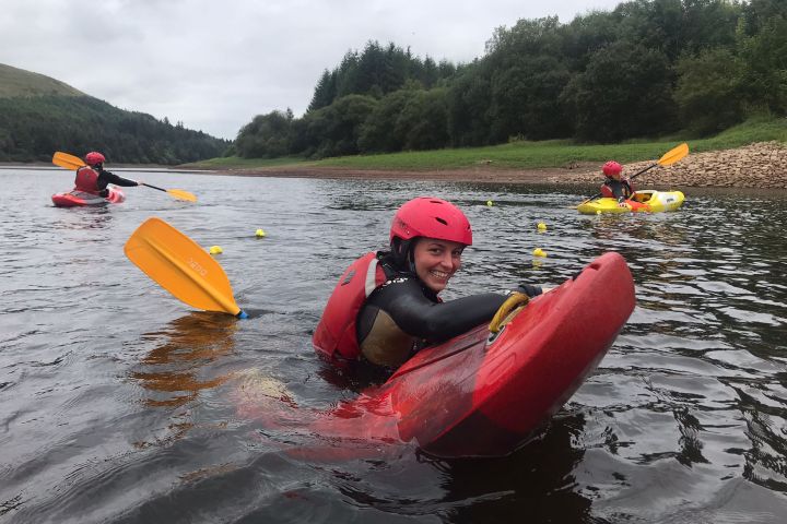 a group of people on a raft in a body of water