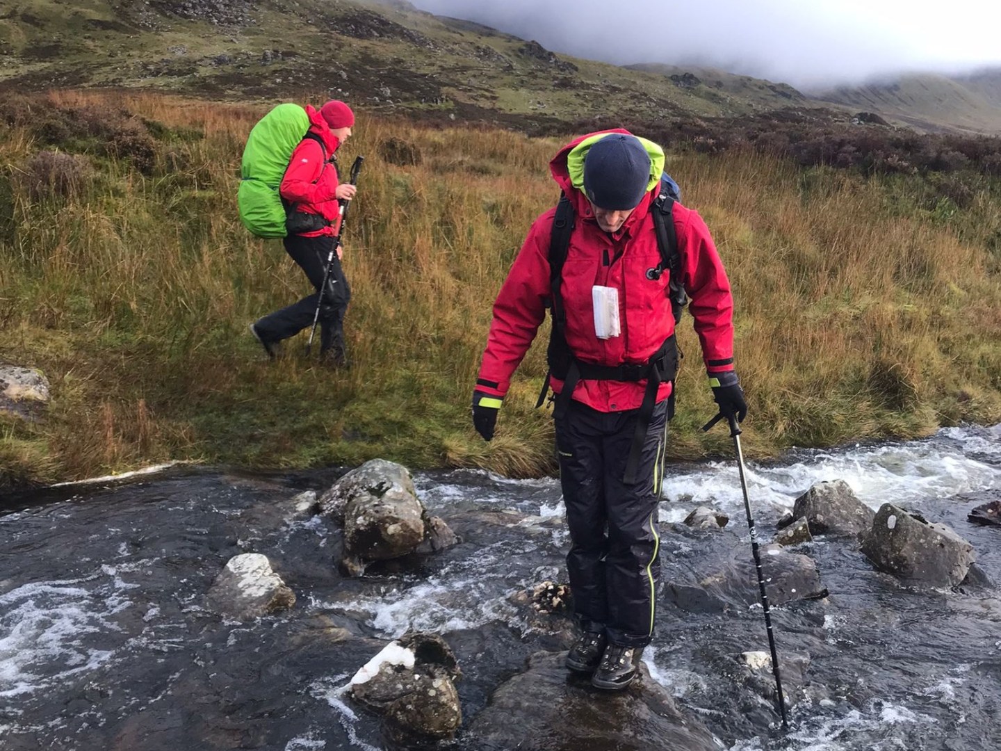 a man riding a bike down a dirt road