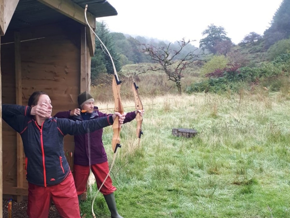 a person standing on top of a grass covered field