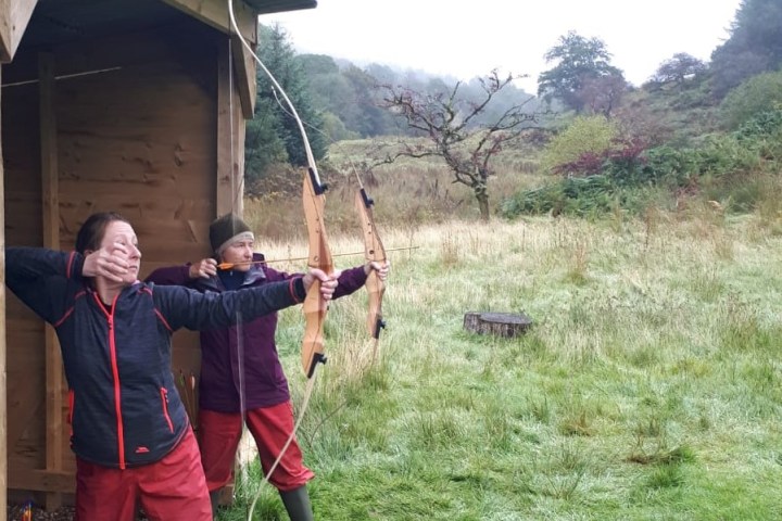 a person standing on top of a grass covered field