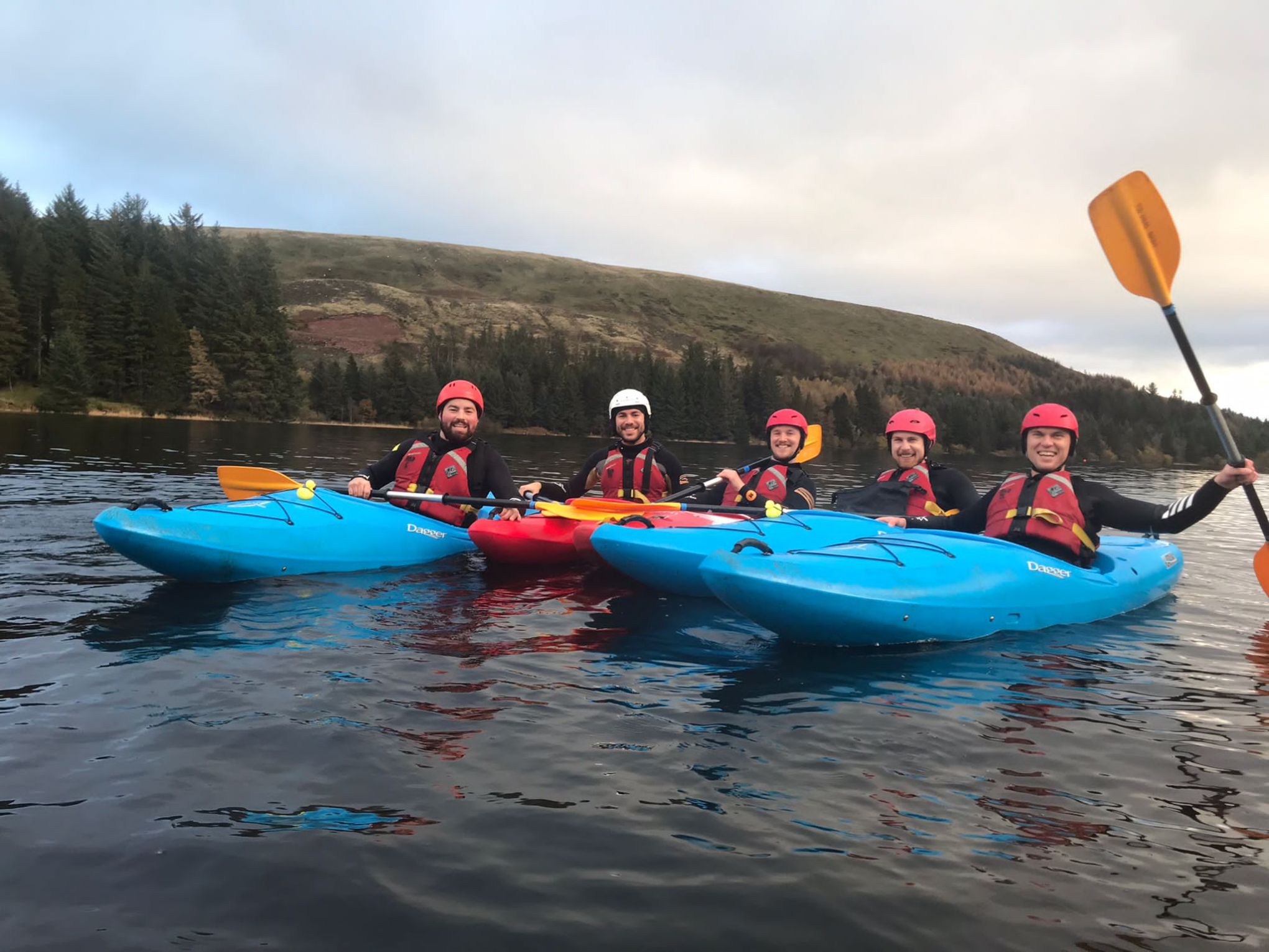 a group of people on a boat in the water