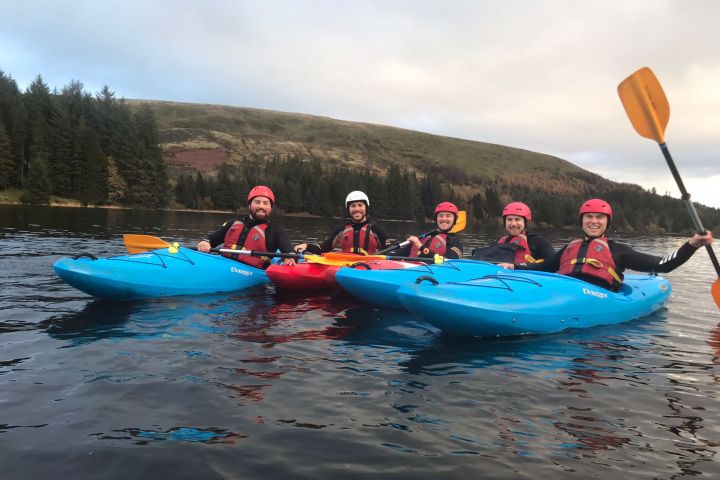 a group of people on a boat in the water