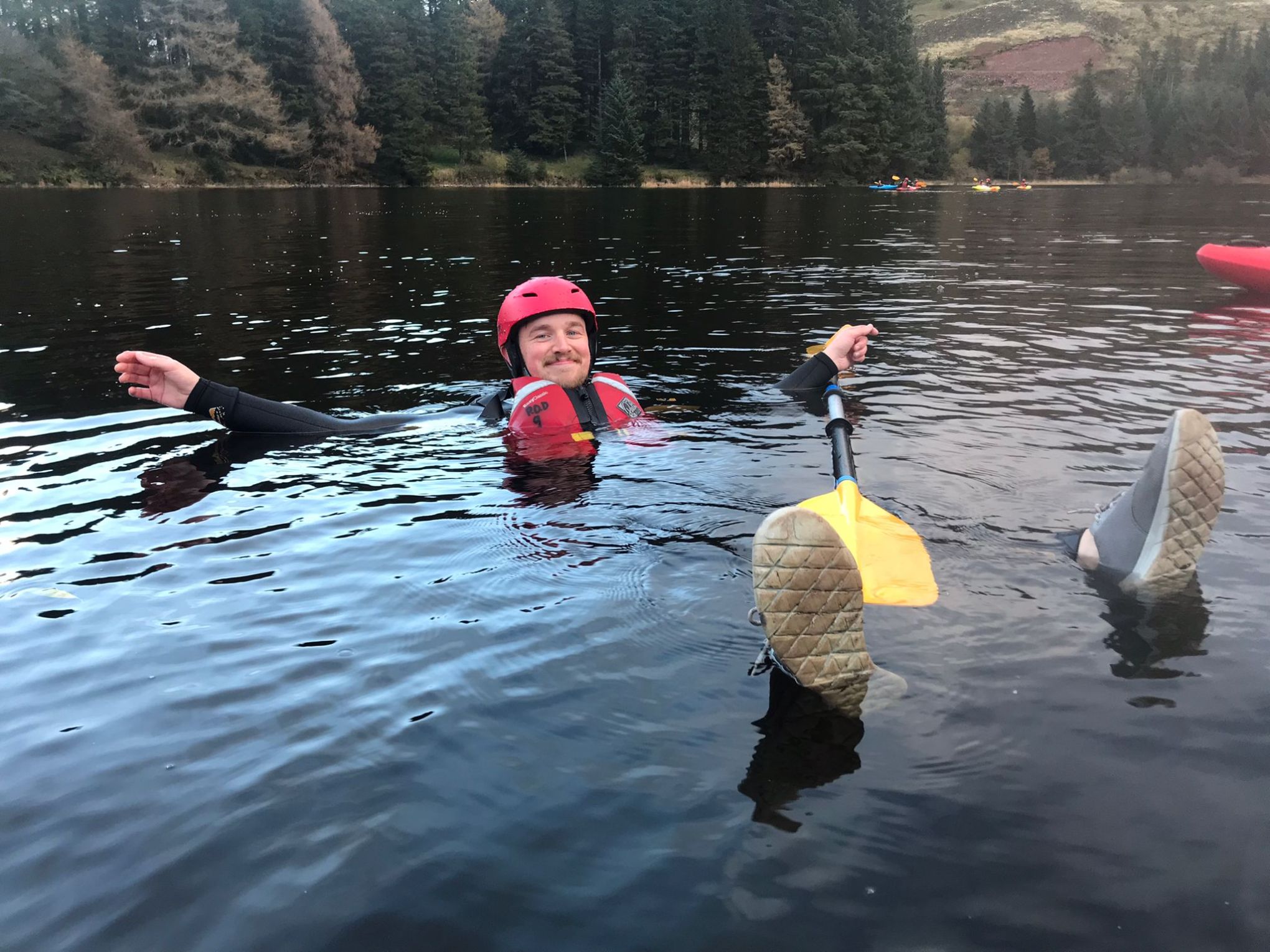 a group of people swimming in a body of water