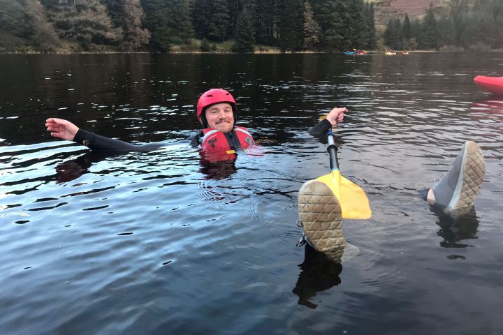 a group of people swimming in a body of water