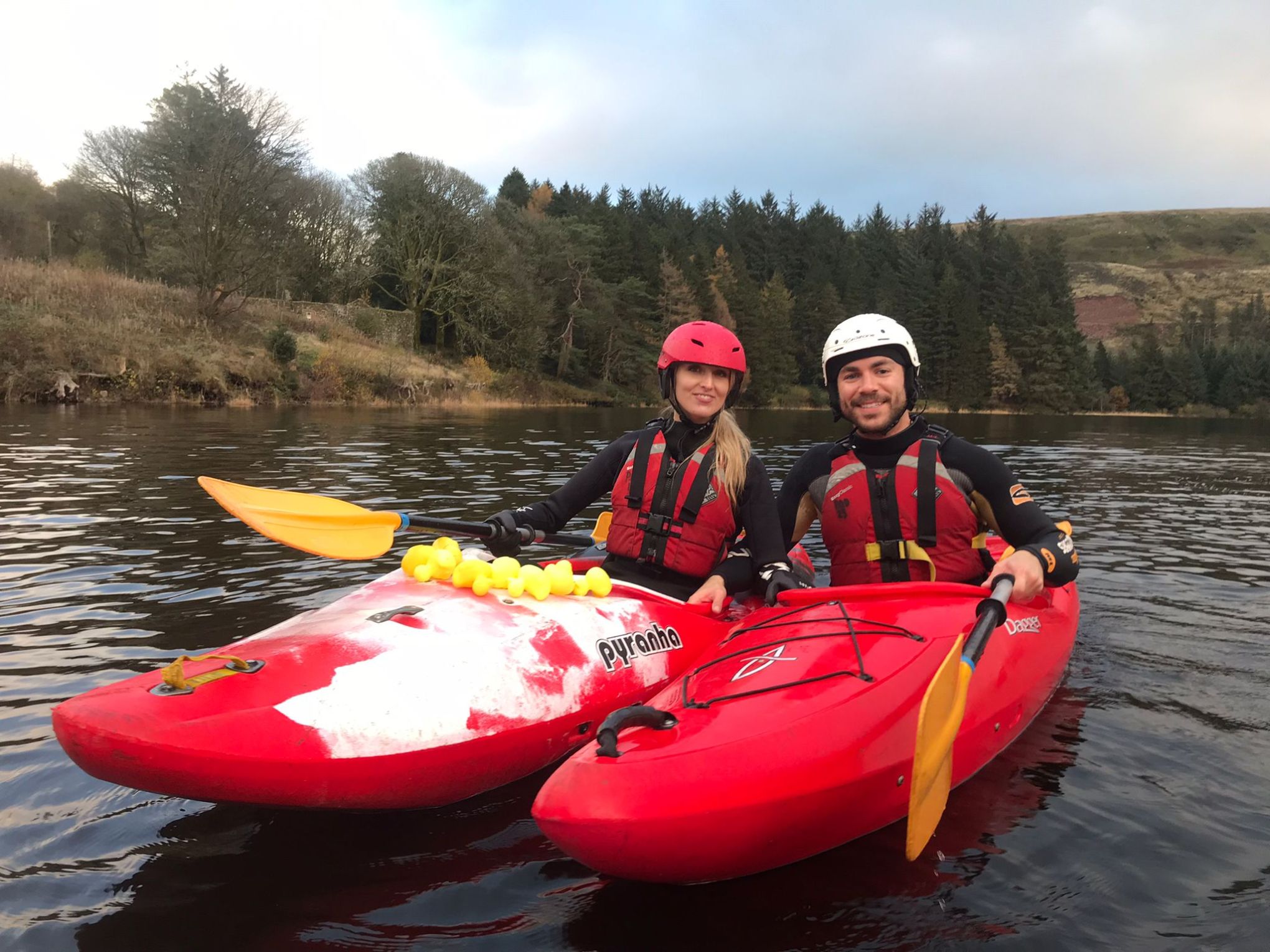 a person riding on the back of a boat in the water