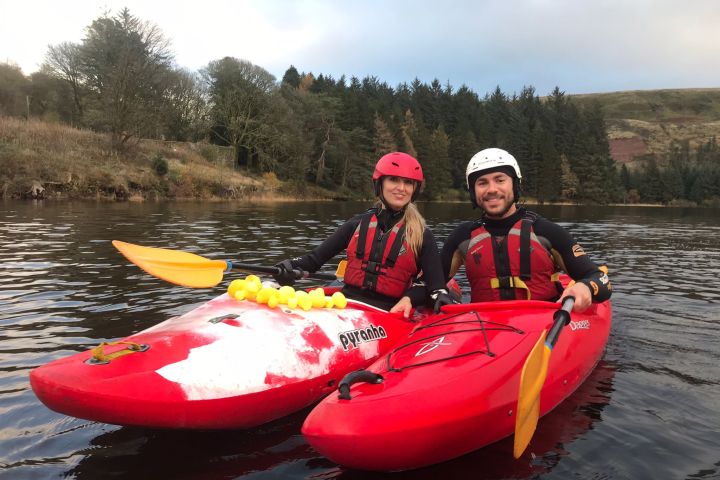 a person riding on the back of a boat in the water