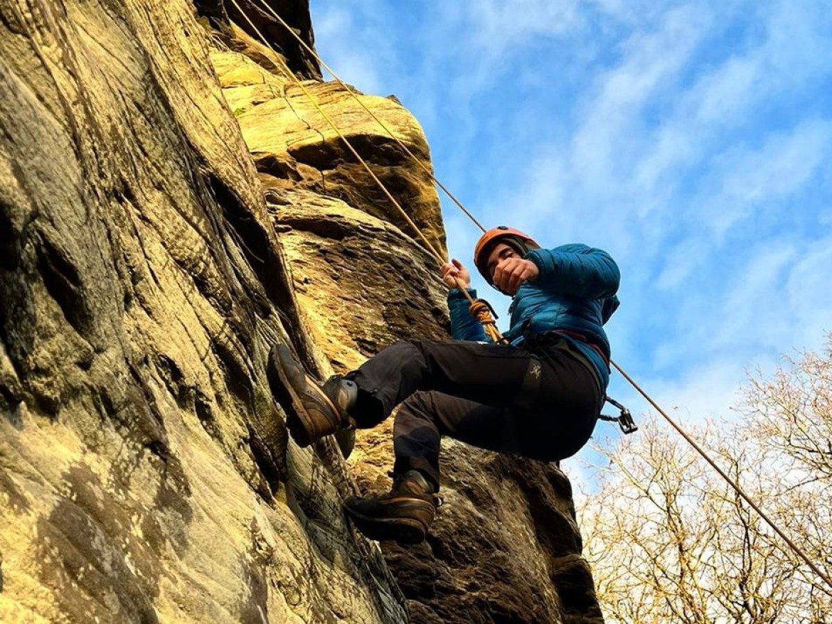 a person standing on a rock