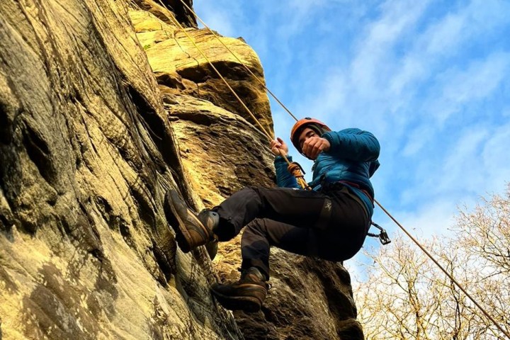 a person standing on a rock