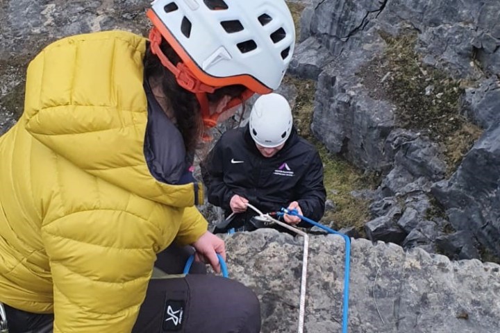 a person sitting on a rock