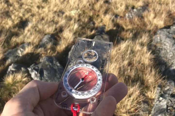 a hand holding a cell phone