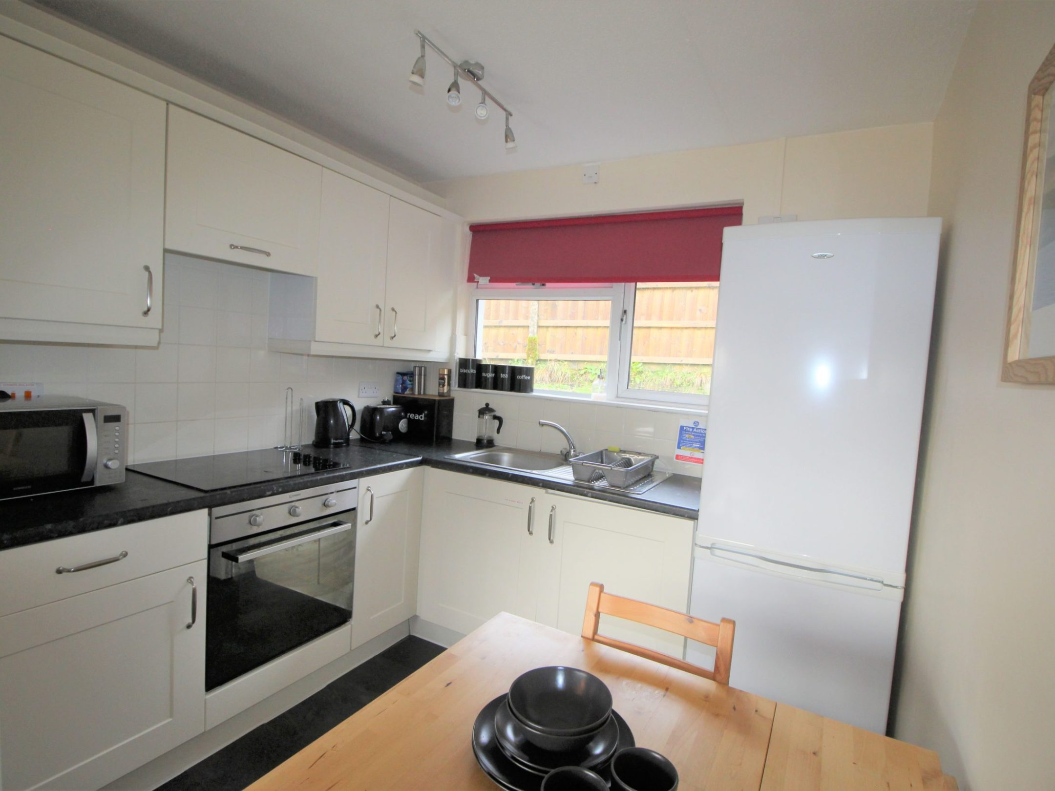 a stove top oven sitting inside of a kitchen