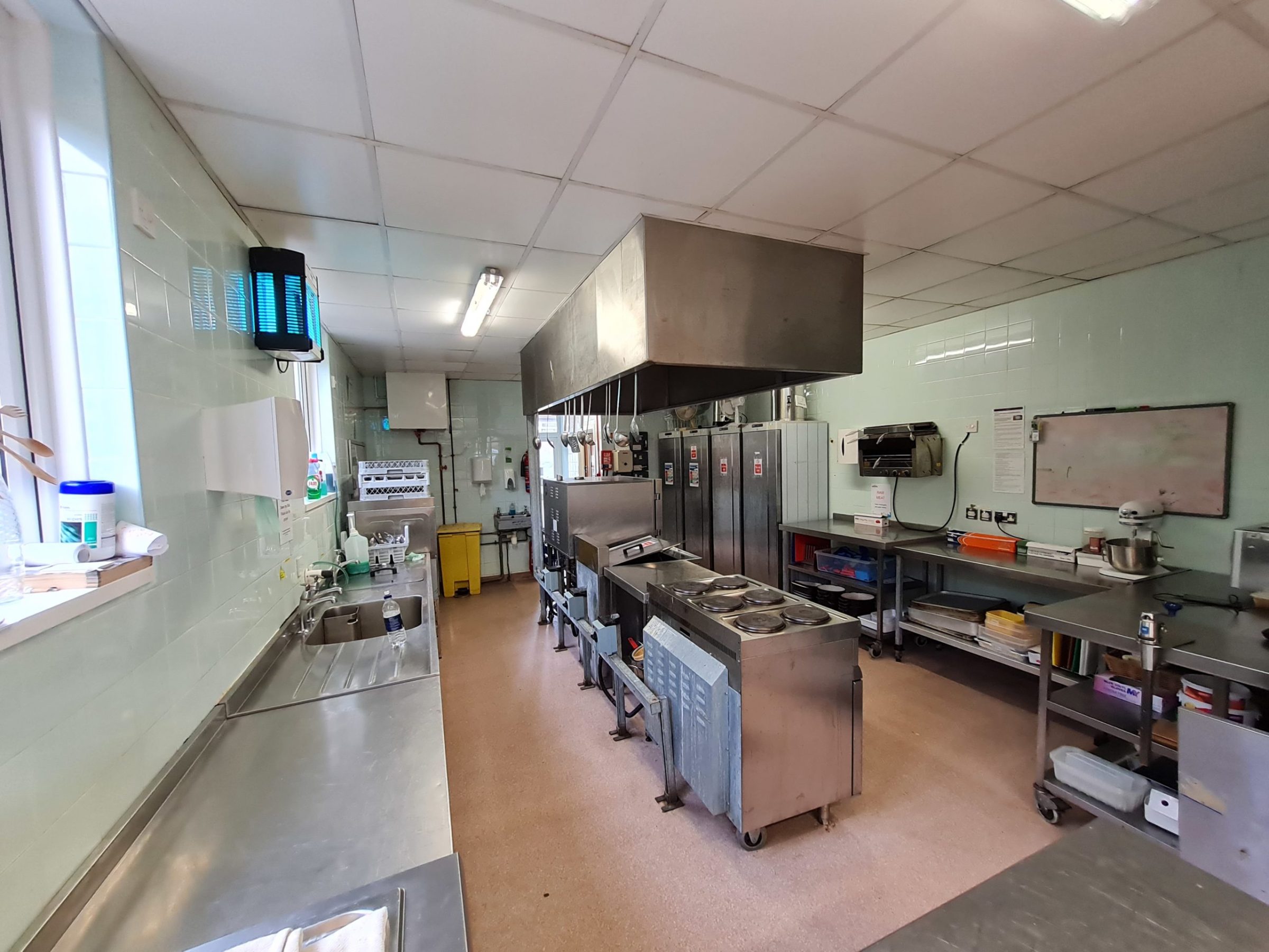 a group of people in a kitchen