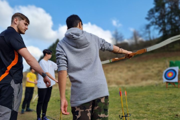 a young boy flying a kite