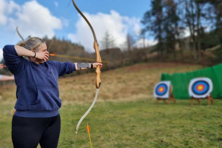 a woman holding a kite