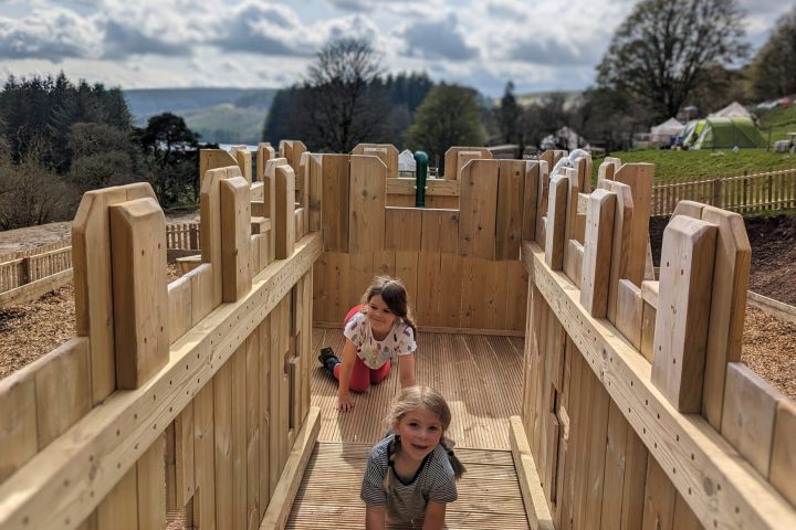 Riley Ann Sawyers standing next to a fence