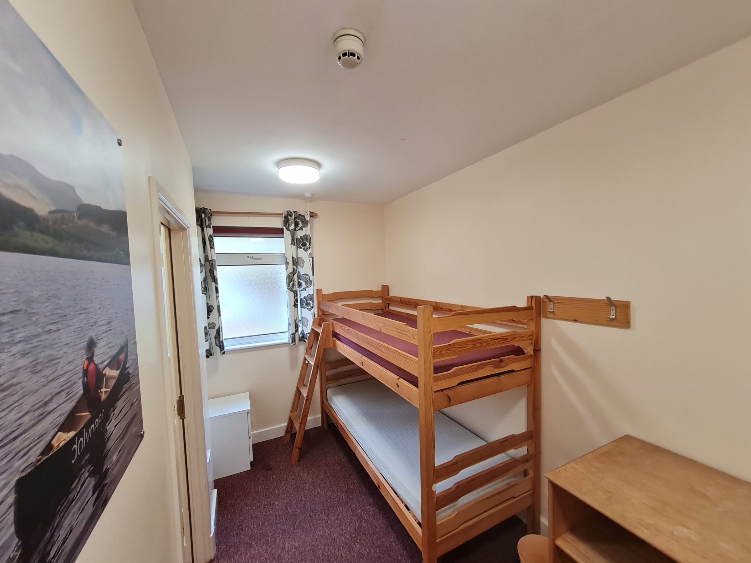 a bedroom with a bed in a room