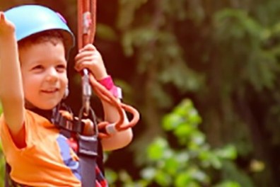 a young boy holding a baseball bat