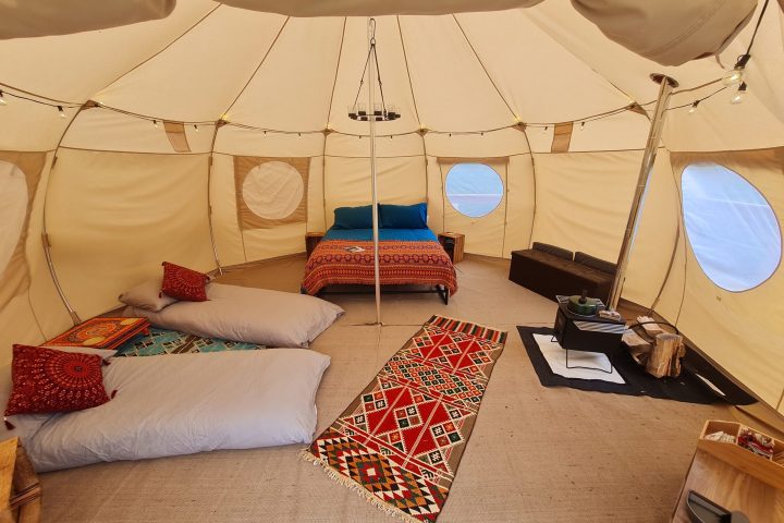 a bedroom with a bed and a table