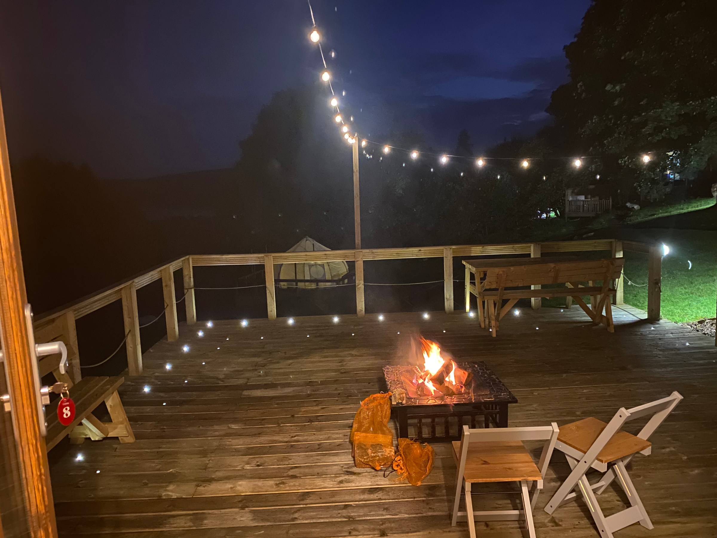 Fire pit and lights on the Pod deck