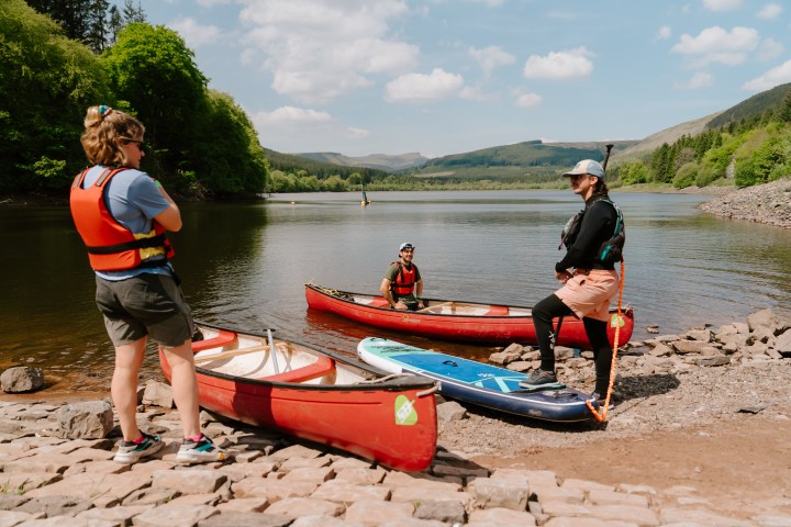 a group of people in a boat on a body of water